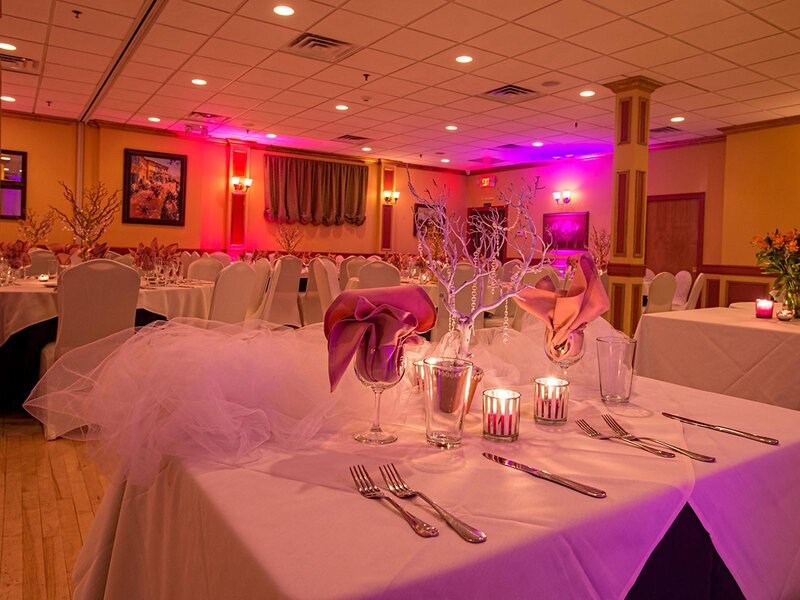Duomo room with set table with pink and purple linen