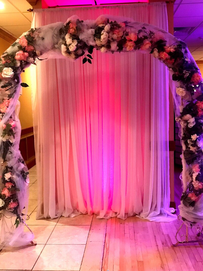 Wedding archway decorated with flowers